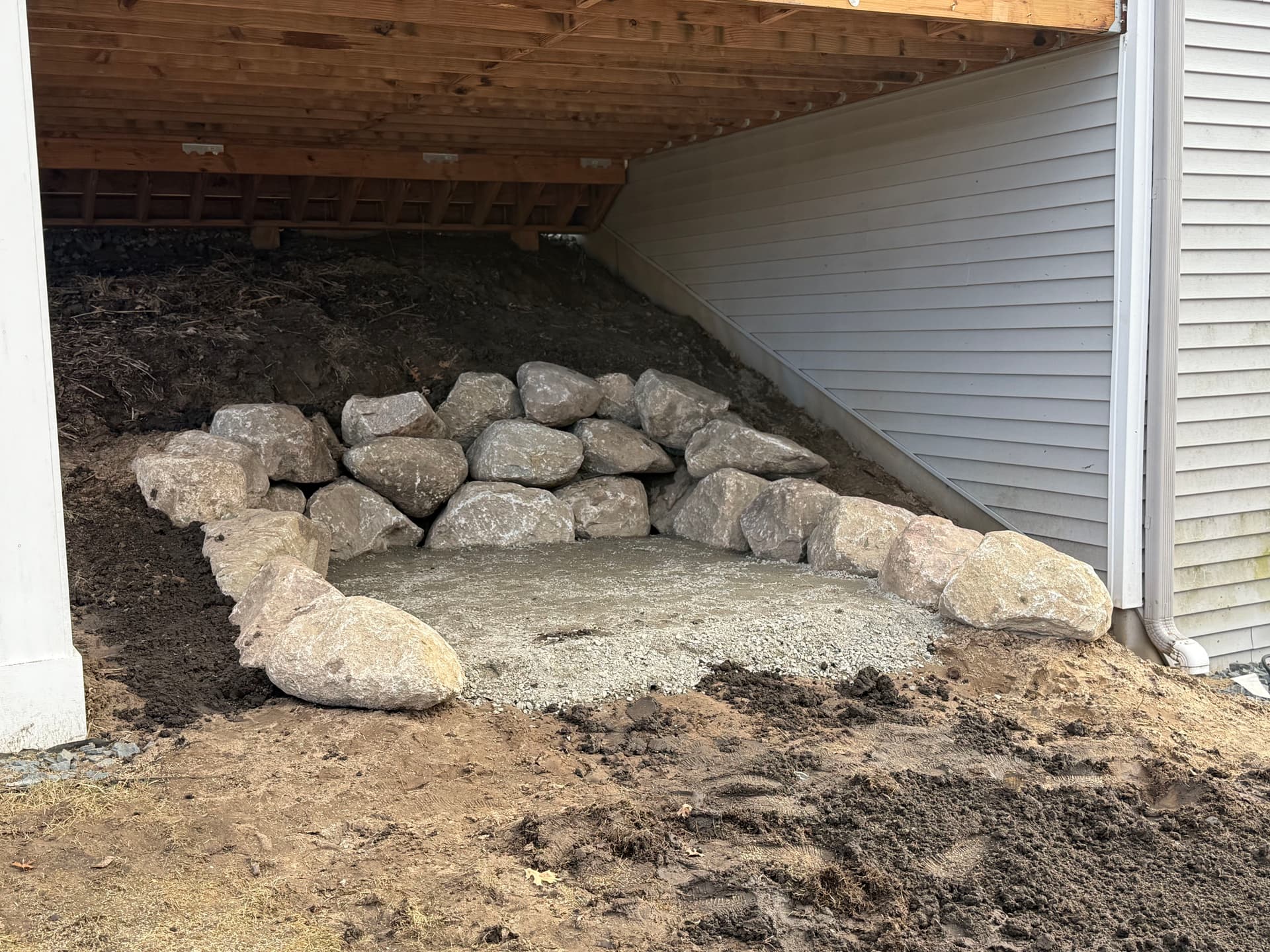 Boulder Wall Installation Under the Deck in Ham Lake