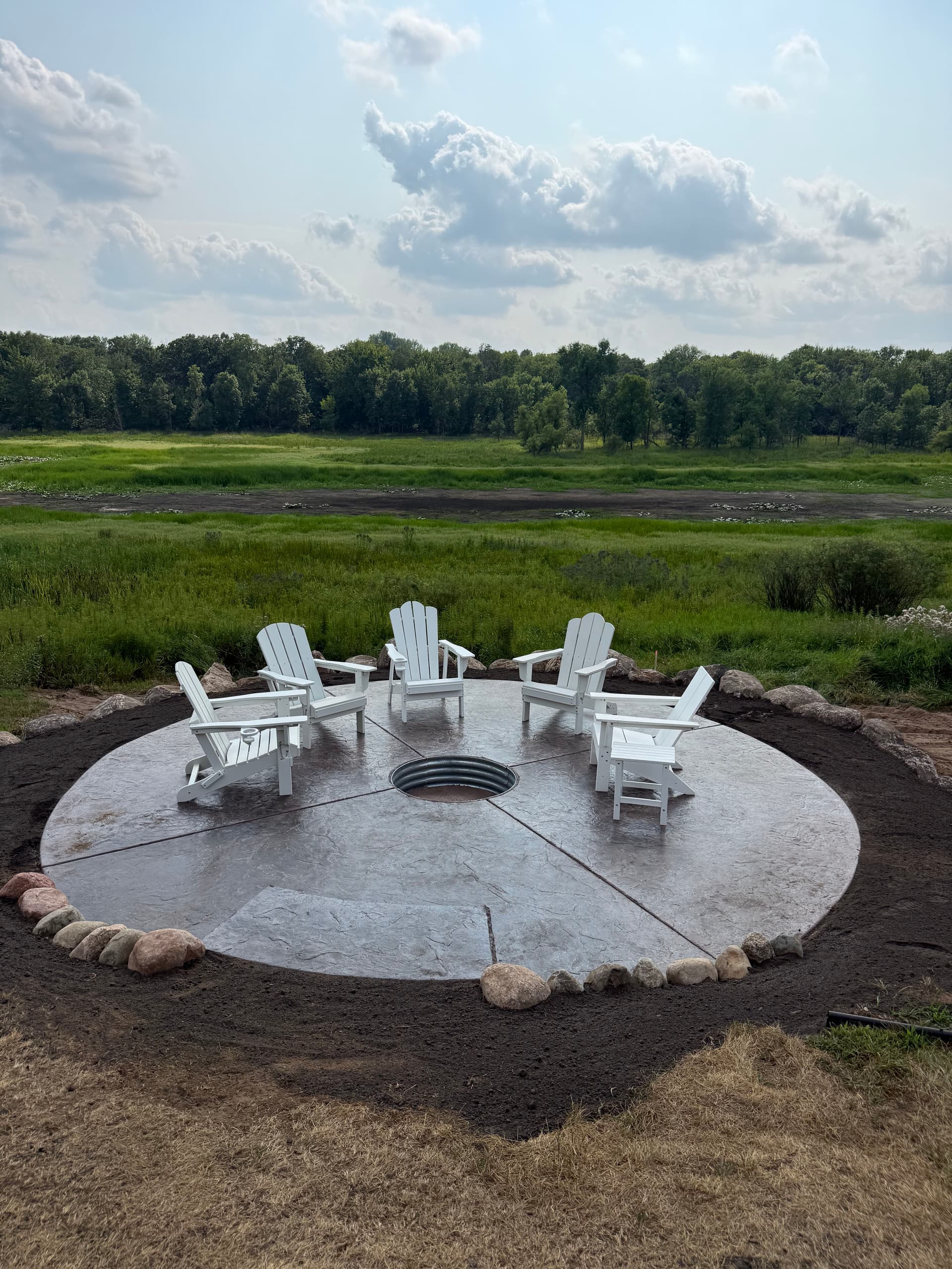 Stamped Concrete Patio and Boulder Wall in Isanti